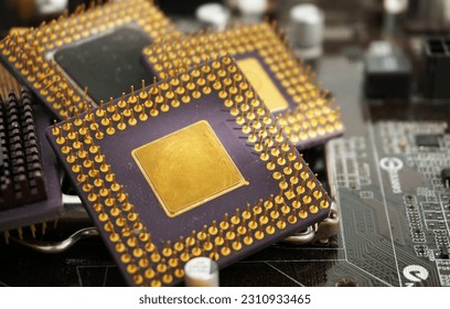 Close up old cpu microprocessor obsolete computer With gold as ingredient and motherboards. E-waste is a problem with environmental concepts, it should be recycled. - Powered by Shutterstock - Get 15% off with code: PIKWIZARD15