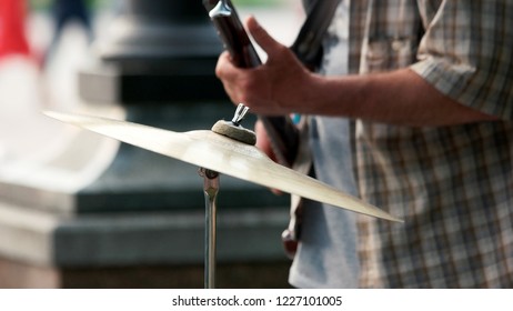 Close Up Of An Old Cymbal Outdoor. Cropped Image Of Drum Set. Drum Kit Details. Musician Playing On Guitar. Live Concert Outdoor. Musical Concept.