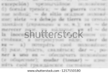 Close up the old dictionary page with the solution for the word, beautifully blurred words