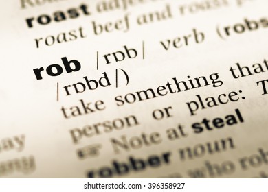 Close Up Of Old English Dictionary Page With Word Rob