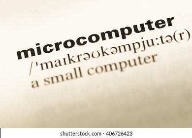 Close Up Of Old English Dictionary Page With Word Microcomputer