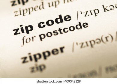 Close Up Of Old English Dictionary Page With Word Zip Code