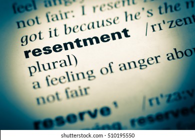 Close Up Of Old English Dictionary Page With Word Resentment