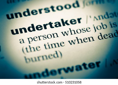 Close up of old English dictionary page with word undertaker - Shutterstock ID 510231058