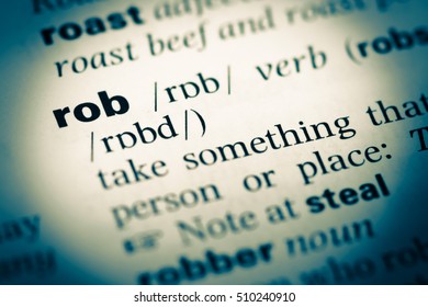 Close Up Of Old English Dictionary Page With Word Rob