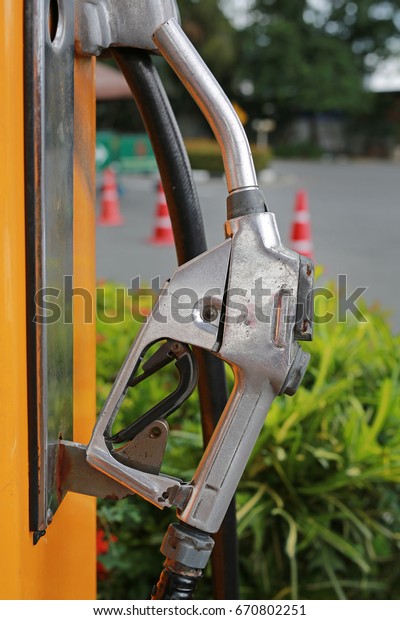 Close up the old Gas pump\
nozzles