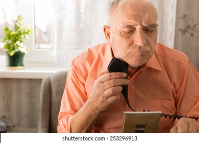 Close Up Old Man Shaving Beard With Electric Razor Seriously In Front Small Mirror