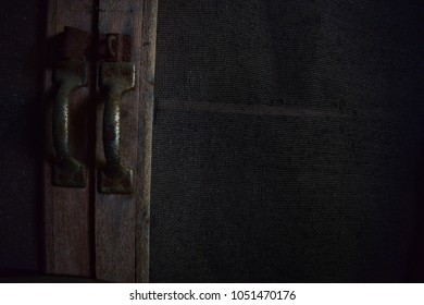 Close up of old pantry door handle. Traditional wooden pantry.