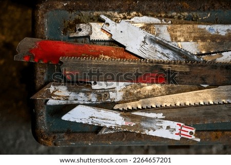 close up of old reciprocating saw blades