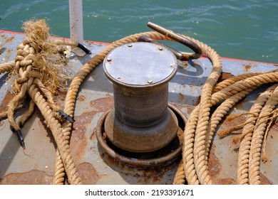 Close up of Old ropes and rusty bollard. rope and Marina bollard on moorage. The concept of mooring and water transportation