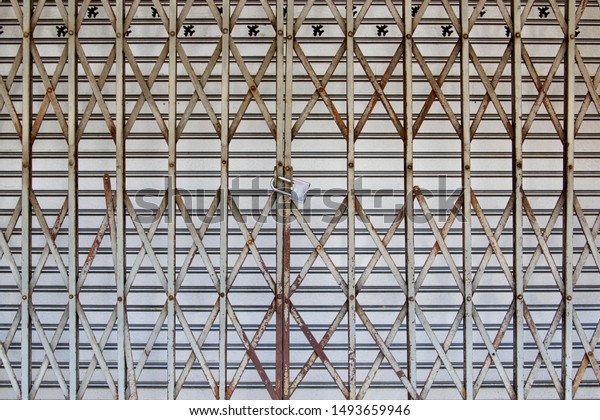 Close Old Rusty Folding Steel Door Stock Photo Edit Now 1493659946