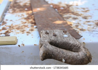 Close up of an old rusty saw