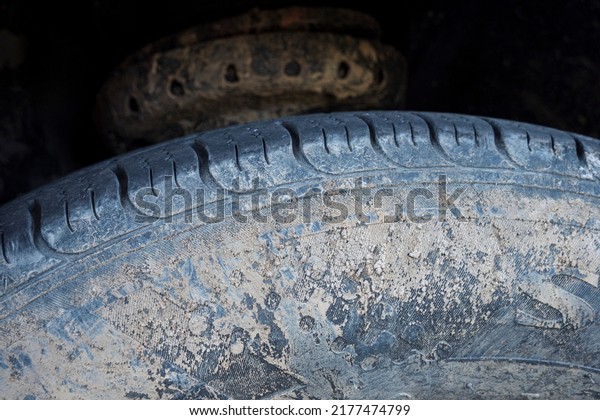 close up of old tire in\
mud