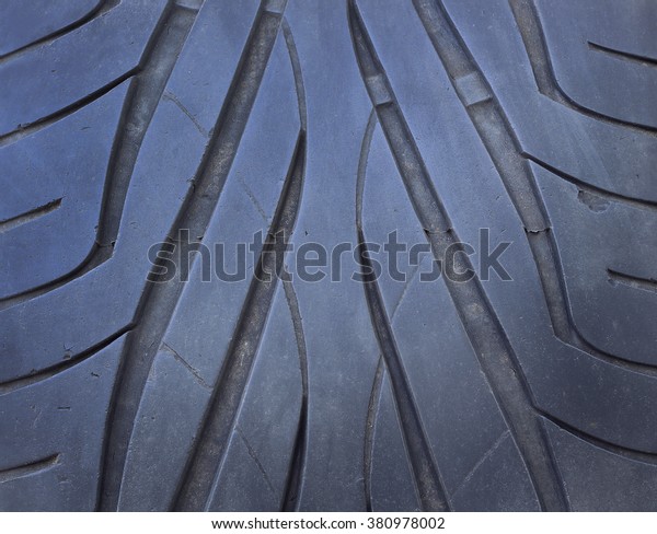 Close up\
of old tire texture. Black rubber\
background.