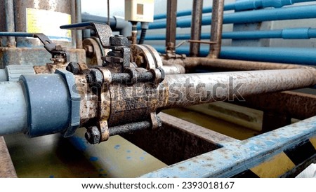 Close up old valve stainless.rust on valve caused by proximity to acid fumes.selective focus.