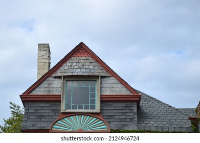 Close Up Of Old Victorian Style Home Window And Weathered Roof In Midwest USA