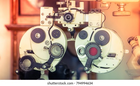 Close Up Of Old Vintage Eyesight Measurement Or Ophthalmologists With Optical Phoropter. Eye Sight Vision Test Machine Measurement With Vintage And Retro Photo Effect.