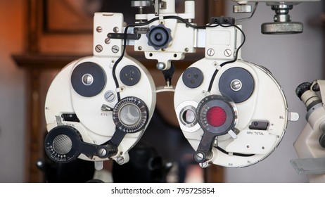 Close Up Of Old Vintage Eyesight Measurement Or Ophthalmologists With Optical Phoropter. Eye Sight Vision Test Machine Measurement With Vintage And Retro Photo Effect.