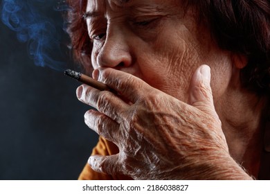 old woman smoking cigarette