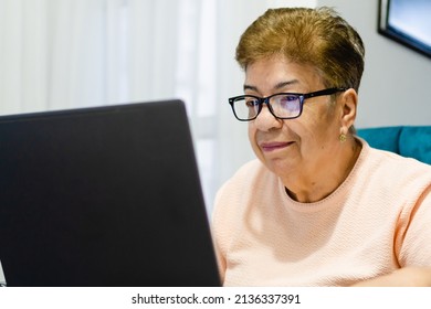 Close Up Of An Older Latina Woman Using A Laptop Computer