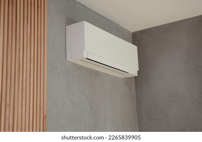 Close up on Ac Unit i modern house interior. Indoor AC unit wall mounted. - Shutterstock ID 2265839905