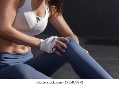 Close Up On Asian Female Boxer Grab Her Knee With Pain From Her Knee Injury