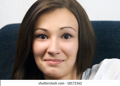 Close Up On A Beautiful Teenager With A Sarcastic Smile