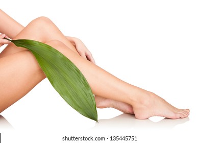 Close Up On Beautiful Woman Legs In Spa. Isolated On White Background