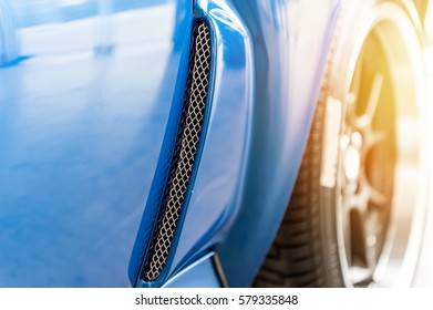 Close Up On A Blue Car In Sunlight