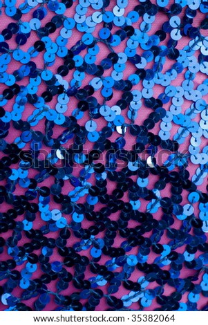 A close up on blue sequined material