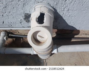 A Close Up On A Broken Ventilation Pipe With A Hole Outside  Connected To The Toilet