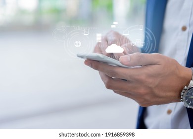 close up on businessman hand holding smartphone to synchronize on SaaS host server to working on system for technology and business concept