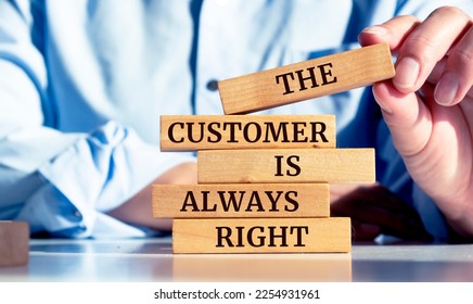 Close up on businessman holding a wooden block with "The Customer is Always Right" message - Shutterstock ID 2254931961