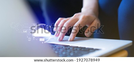 close up on businesswoman hand working on laptop to synchronize on SaaS host server to working on system for technology and business concept