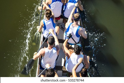 Close - Up On A Canoe Team During A Regatta