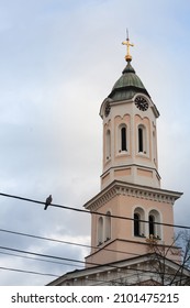 Close up on Church clocktower steeple of the serbian orthodox church of Crkva svetog duha, church of the holy spirit, in Obrenovac, Serbia with its iconic clock indicating the time. 