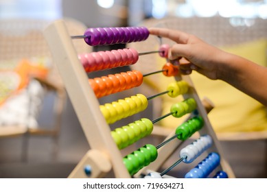 Close up on colorful abacus playful activity, educational interior background. Happy joyful developmental lifestyle - Powered by Shutterstock