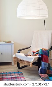 Close Up On A Corner Of A House With A Chair And Nightstand