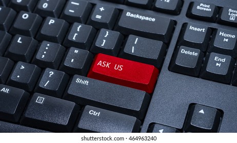 Close up on customized computer enter button on keyboard with a word ask us.