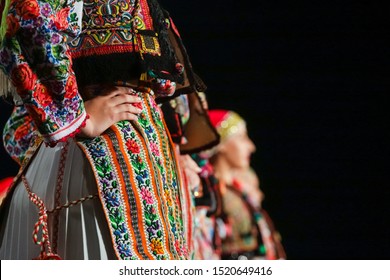 Close Up On Detail Of Young Romanian Female Dancer Traditional Folkloric Costume. Folklore Of Romania