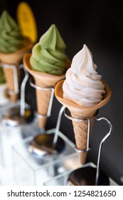 Close Up On A Display Of Soft Serve Ice Cream In Sugar Cones