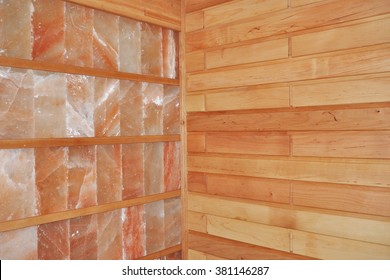 Close up on Dry Salt Sauna with wooden and himalayan salt walls.
