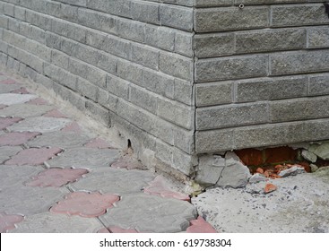 Close Up On Foundation Repair - Warning Signs. House Foundation Repair.Broken Foundation House Brick Wall.