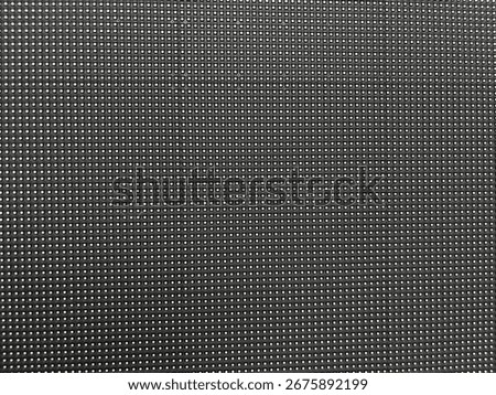 Close up on the front of a large led screen, showing the individual pixels that form the digital display, a concept for technology, advertising, and futuristic design. High quality photo