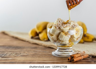 close up on glass jar with pieces of banana with oats and honey - Powered by Shutterstock