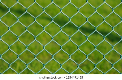 Close Up On Green Chain Link Fencing