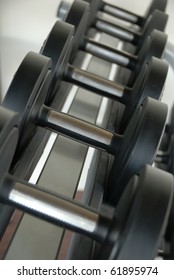 Close Up On Gym Workout Dumb Bells