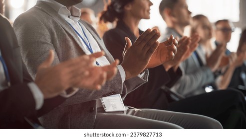 Close Up on Hands of Audience of People Applauding in Concert Hall During Business Forum Presentation. Technology Summit Auditorium Room With Corporate Delegates. Excited Entrepreneurs Clapping. - Powered by Shutterstock