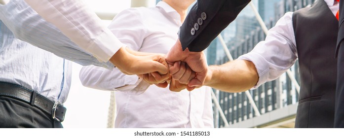 Close Up On Hands Of Business People Join Together On Unity Concept