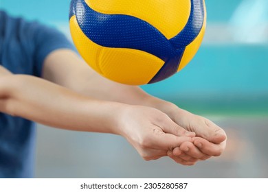Close up on the hands of a girl practicing volleyball skill of digging. Learning to play volleyball on court - Powered by Shutterstock